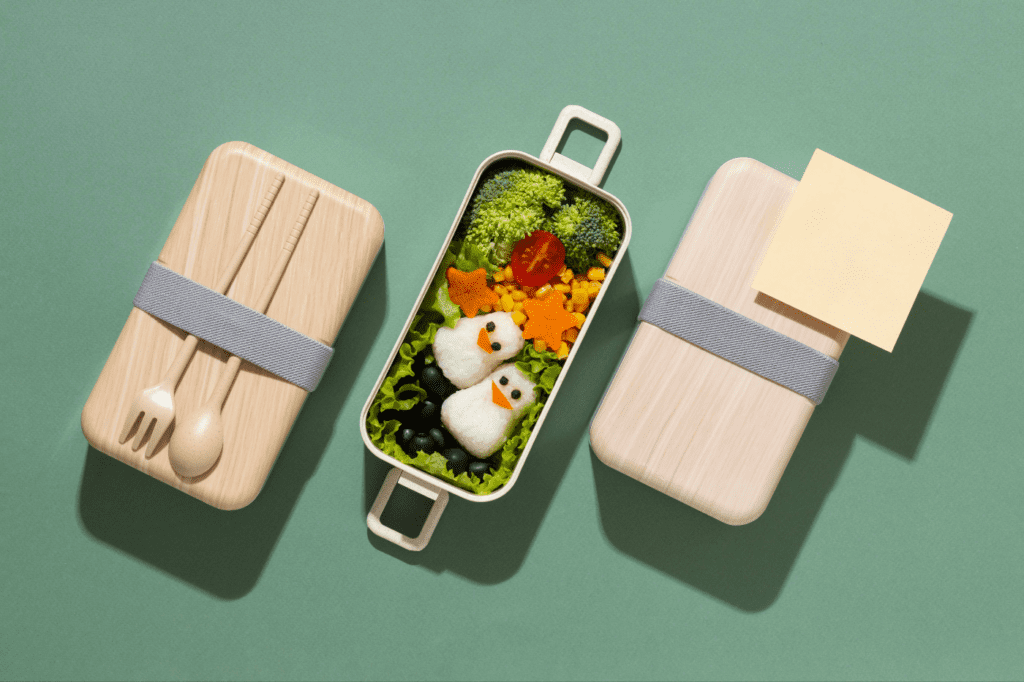 featured image in How to: Minimize Waste (Zero Waste Living Guide 2024) showing lunch in a reusable bento box