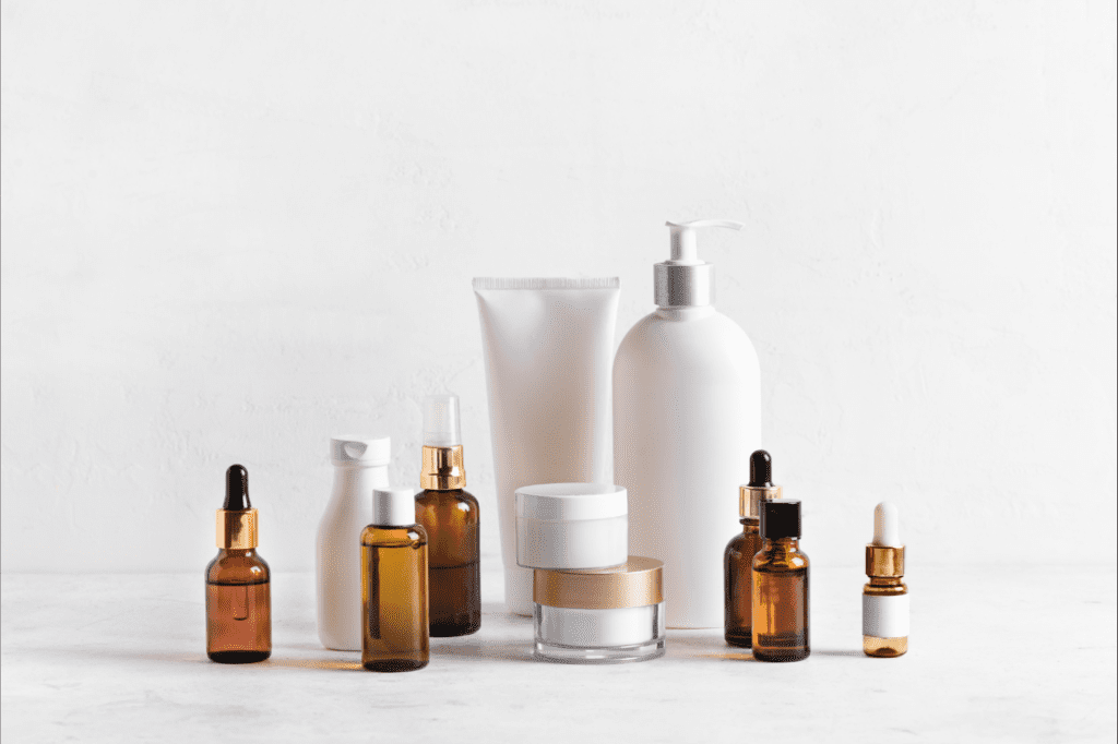 image featured in How To Make Your Skin Care Routine Sustainable in 7 Easy Ways showing make up bottles