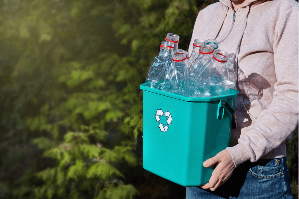 image featured in Must Know: 11 Popular Eco-Friendly Terms And Their Meanings showing plastic bottles in a recycling bin