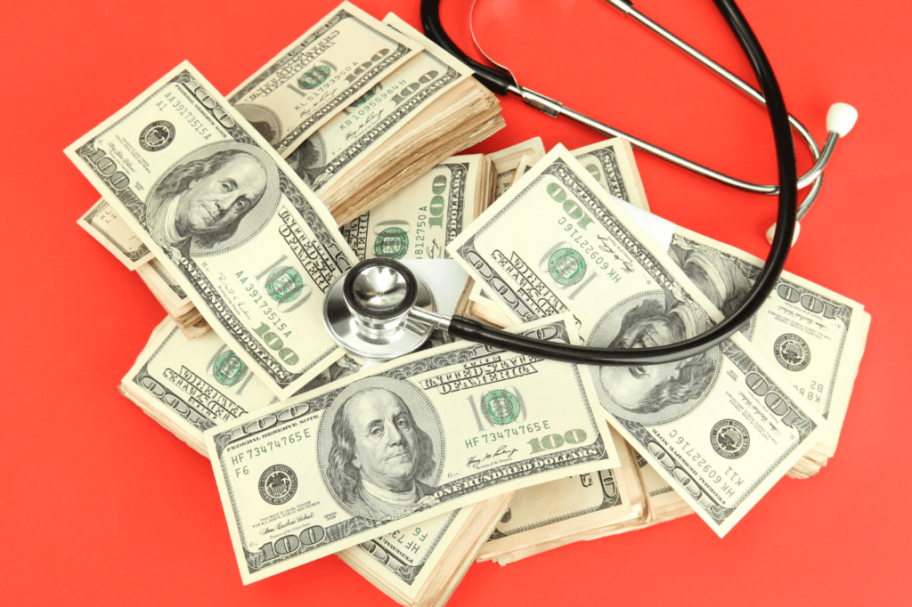 image showing a lot of money and a stethoscope