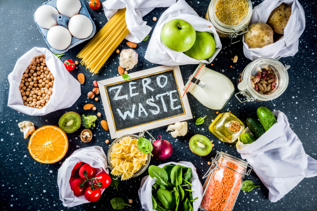 image featured in Your 7-Step Guide to Mindful Consumption | with Helpful Examples + Tips , showing food and a board saying 'zero-waste'