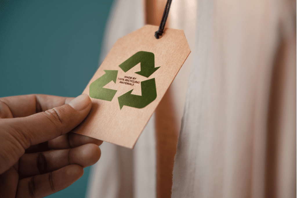image featured in Must Know: 11 Popular Eco-Friendly Terms And Their Meanings showing a sign that says 'made out of recycled fabric'