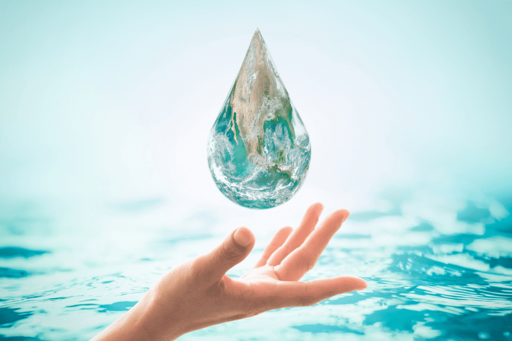 image featured in How To Make Your Skin Care Routine Sustainable in 7 Easy Ways showing a woman holding a water drop