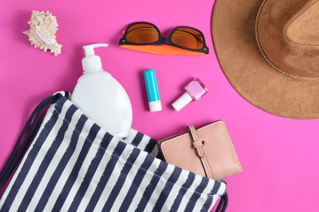 image showing a backpack with sunscreen and sunglasses