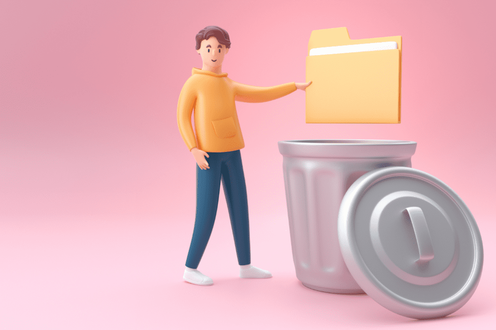 image featured in 23+ Simple Ways to Declutter Your Home (Once and For All!) showing a man throwing a computer data ordner in the trash