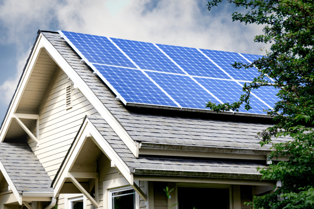 image showing a roof with blue solar panels