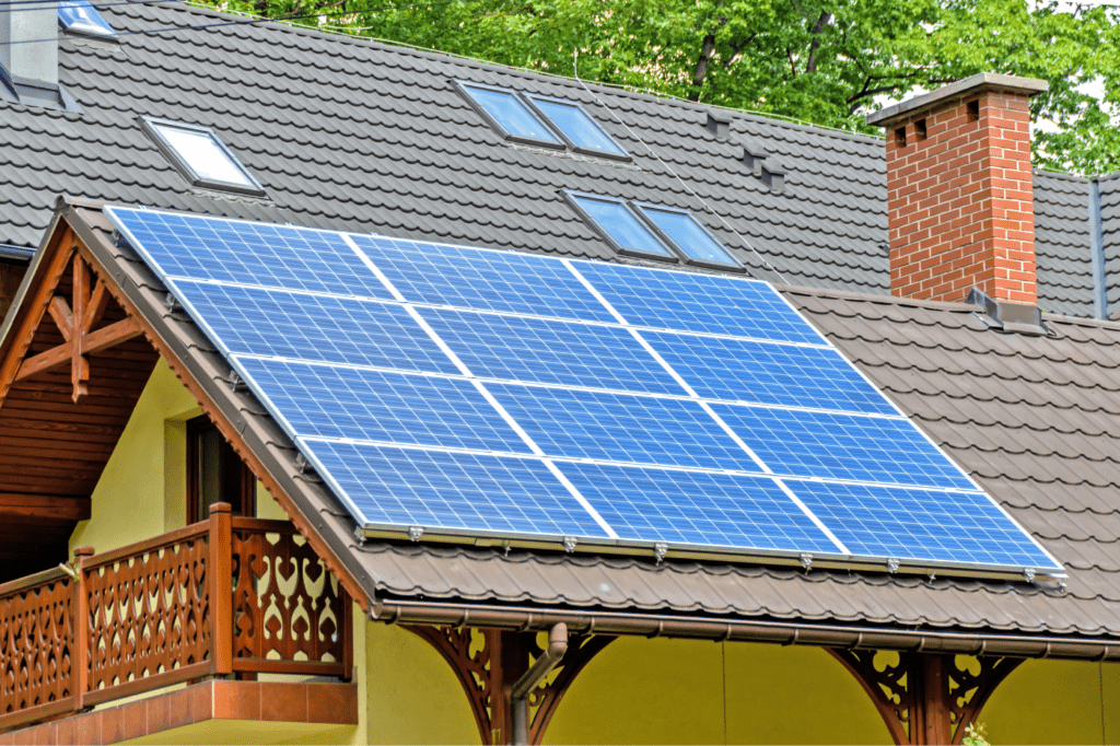 image showing a house with a few solar panels