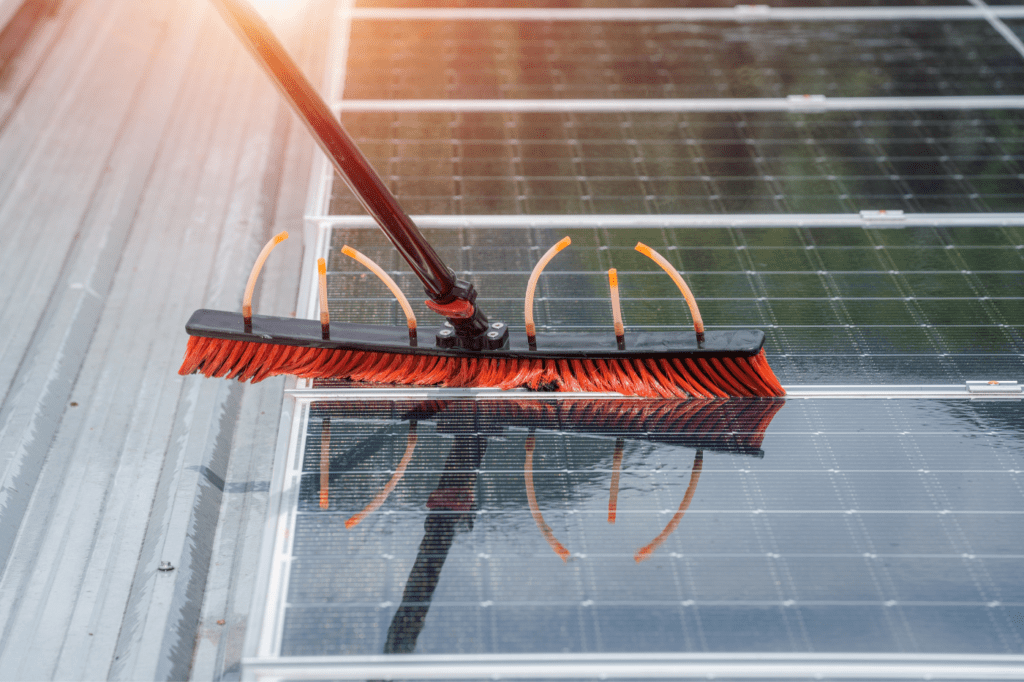 image showing a solar panel being cleaned