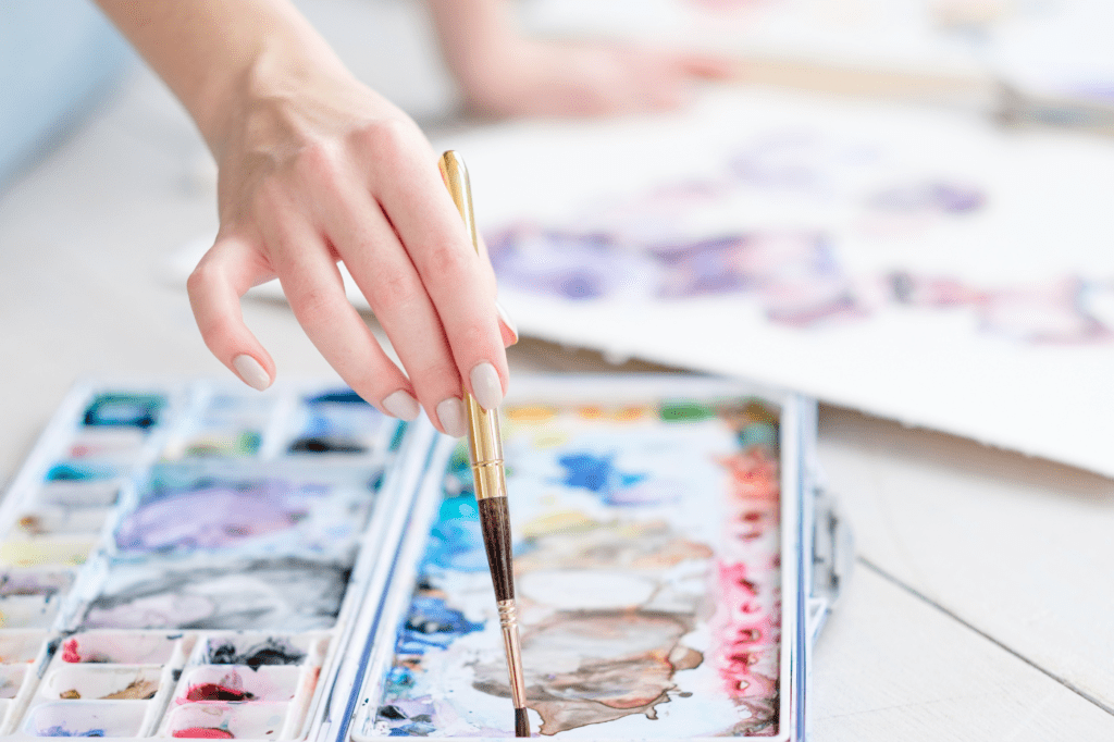 image showing a woman doing watercolors