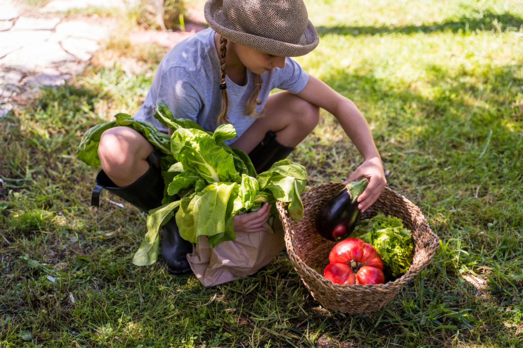 image showing a girl carrying fresh produce