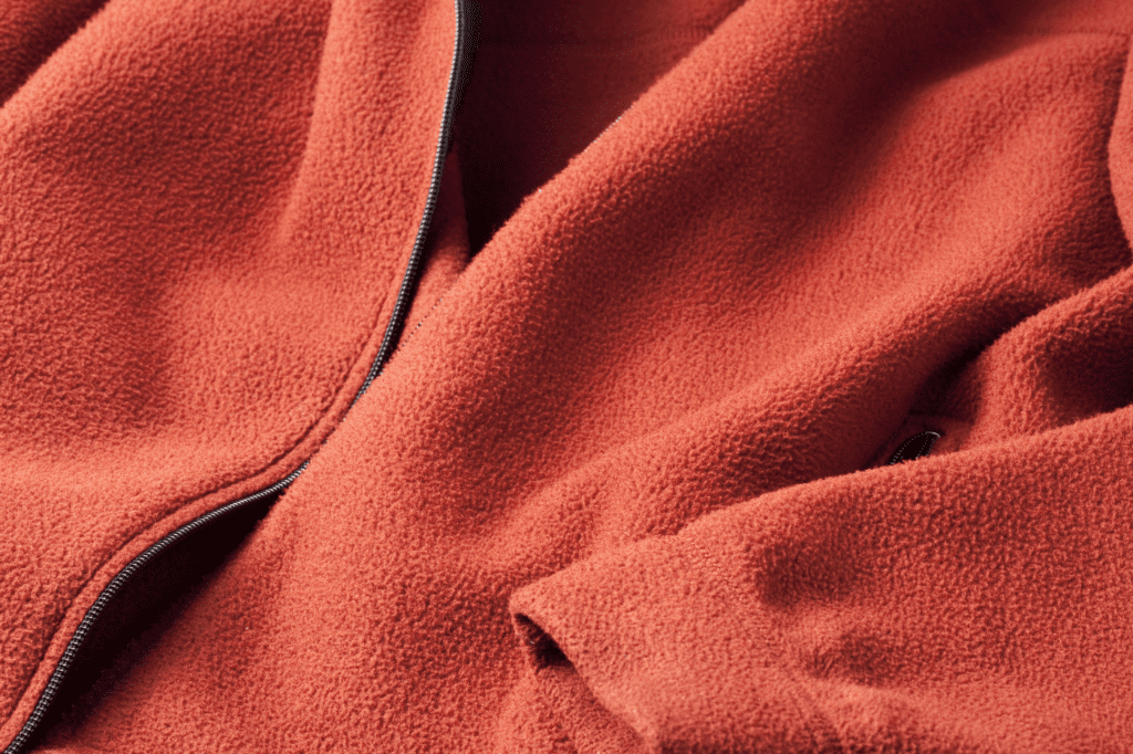 image showing an orange fleece jacket