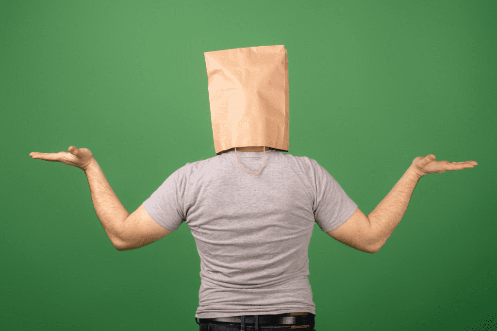 image showing a man with a shopping bag on his head