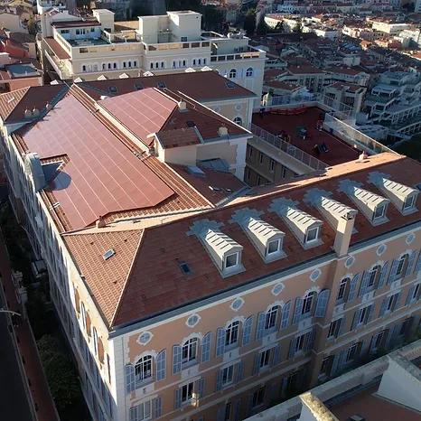 image showing terracotta red solar panels