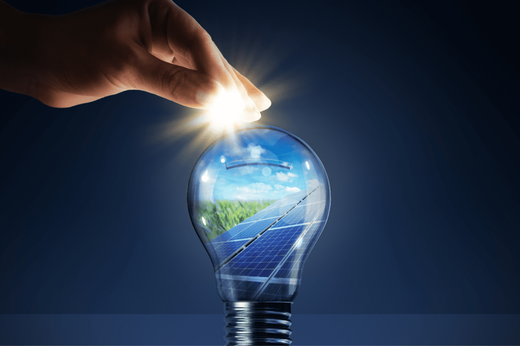image showing a light bulb reflecting the image of a solar panel