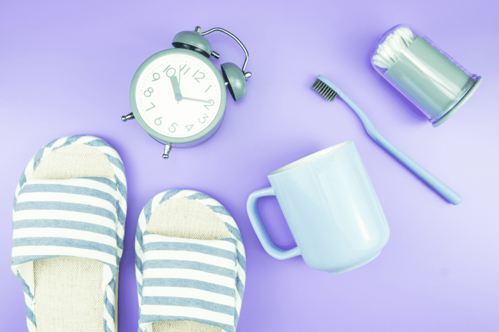 clock, toothbrush and slippers
