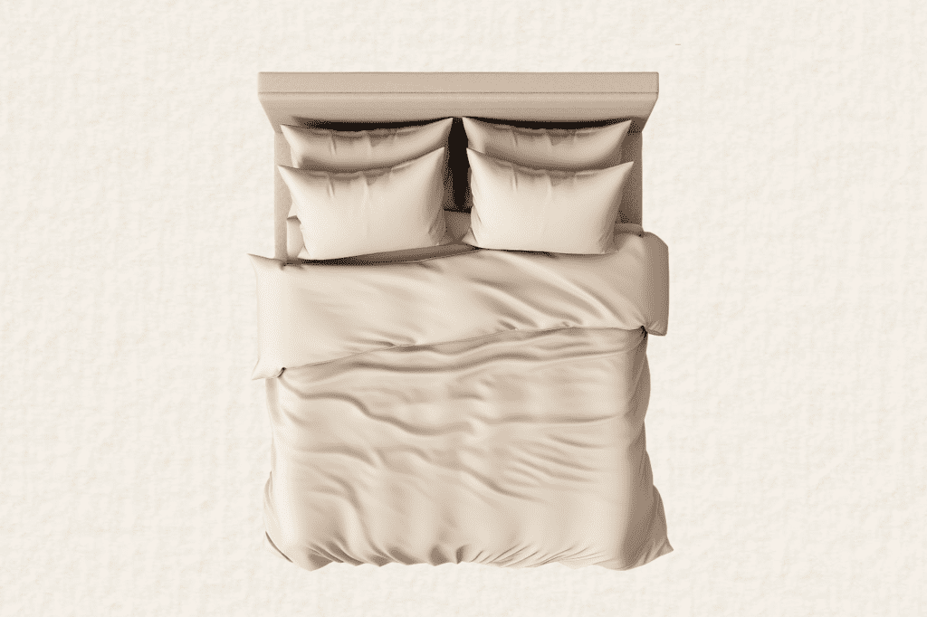 a bed with beige bed sheets